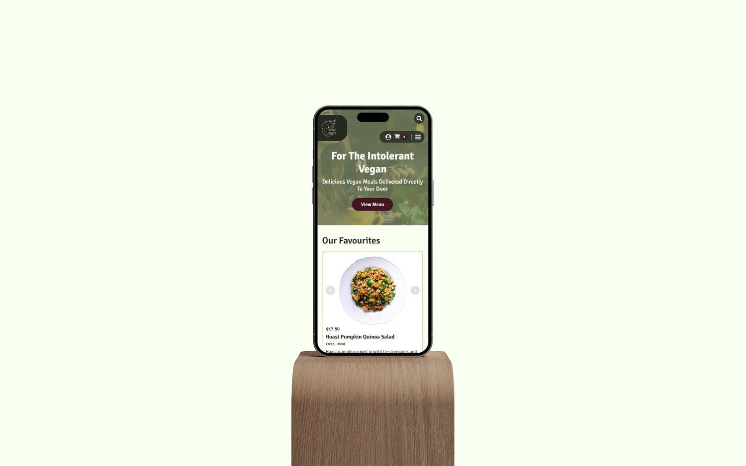 Passel Foods website shown on iphone on a wood plinth
