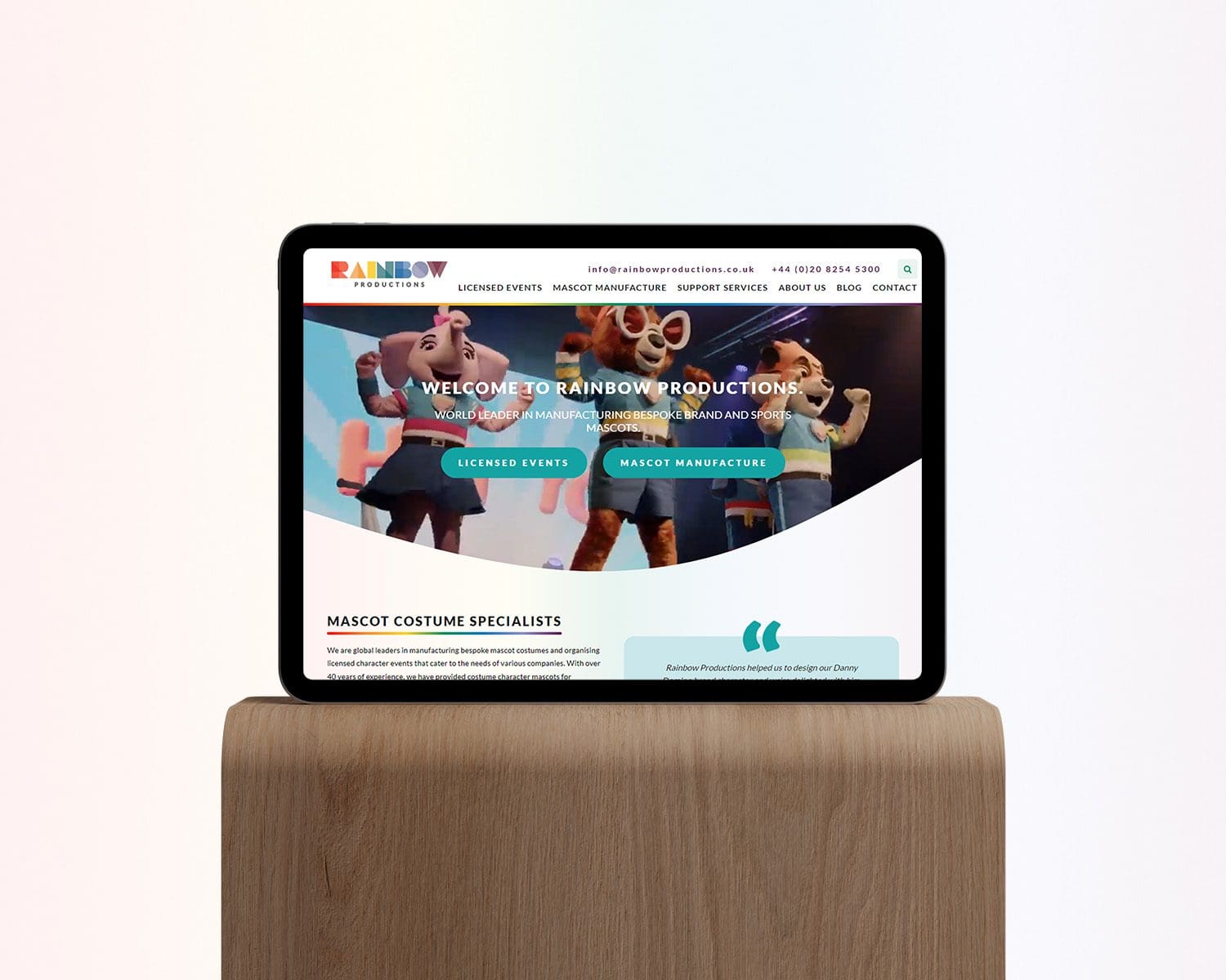 Rainbow Productions website shown on ipad on a wood plinth