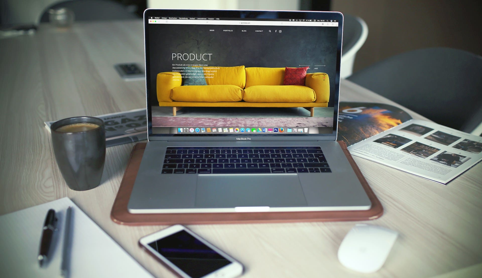 A sofa companies homepage being shown on a MacBook in a home environment